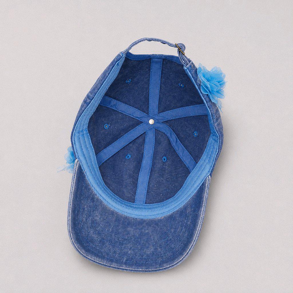 Blue distressed denim baseball cap with nature inspired embellishments