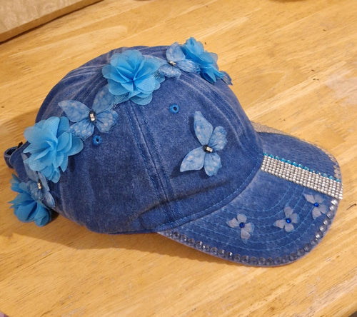 Blue distressed denim baseball cap with nature inspired embellishments
