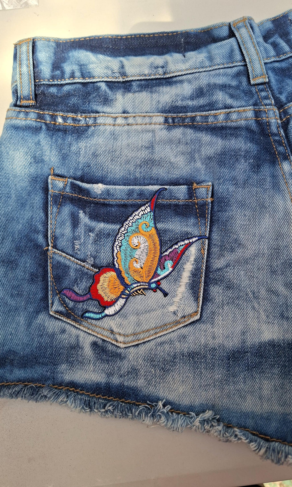 Distressed Ripped Denim Hot Pants Shorts (Size 8) – Hand Painted Flower Detail