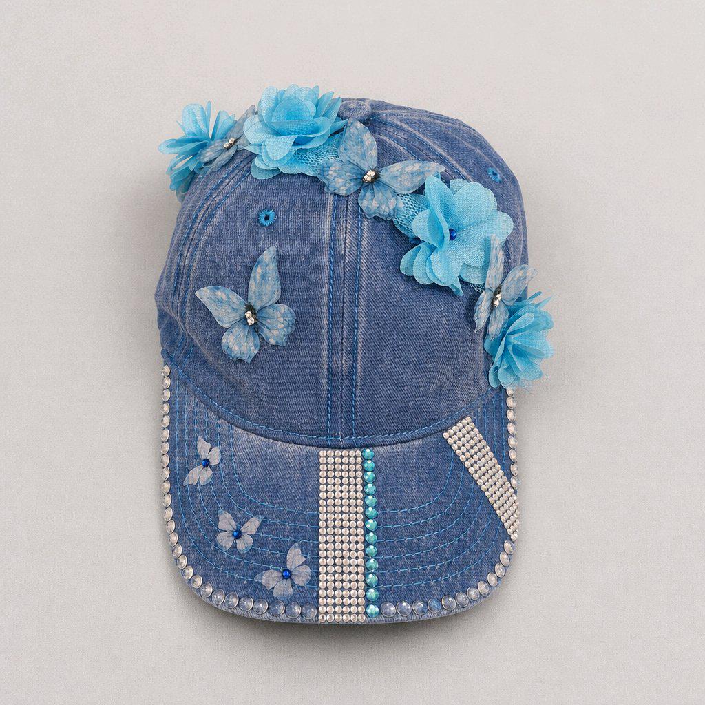 Blue distressed denim baseball cap with nature inspired embellishments